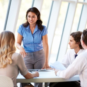 Business People Having Board Meeting In Modern Office